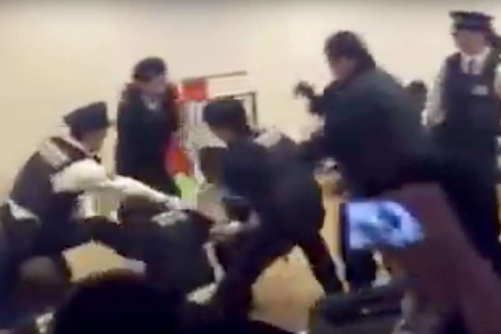 A screengrab of mainland Chinese tourists scuffling with security at Hokkaido airport. Photo: YouTube