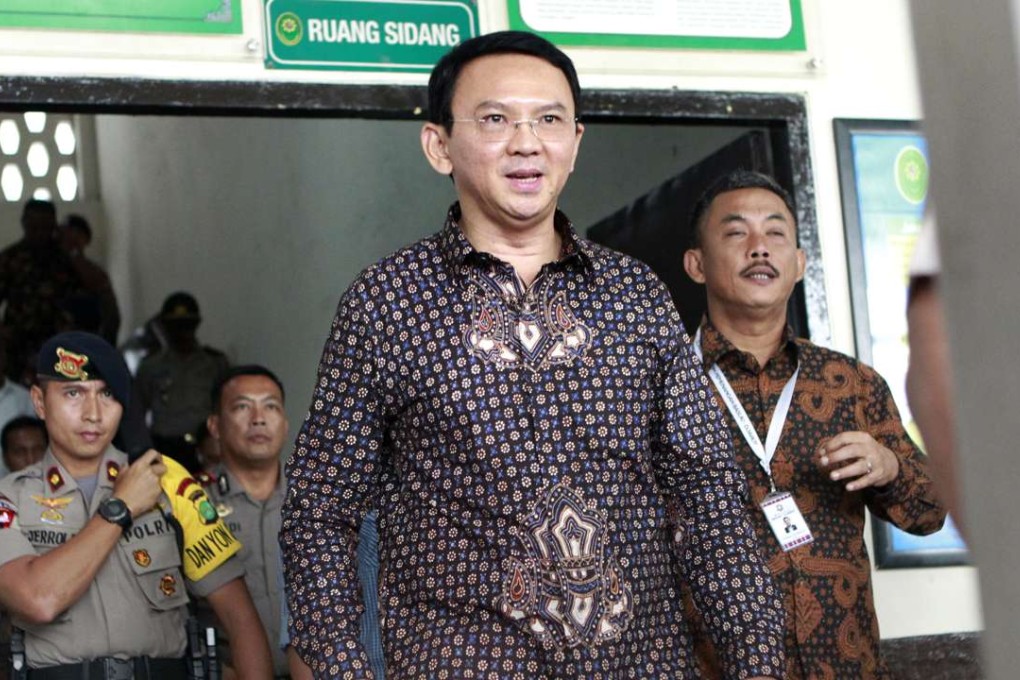 Jakarta Governor Basuki ‘Ahok’ Tjahaja Purnama walks out of a courtroom. Photo: AP