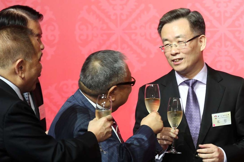 Song Zhe (right), the foreign affairs ministry’s commissioner in Hong Kong since 2012, was named a deputy director of the Hong Kong and Macau Affairs Office. Photo: K.Y. Cheng