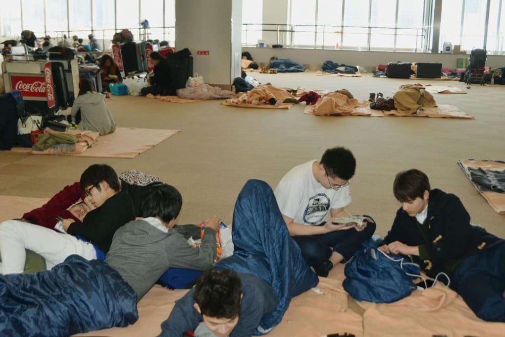 Some of the stranded passengers at New Chitose Airport in Sapporo. Photo: Kyodo
