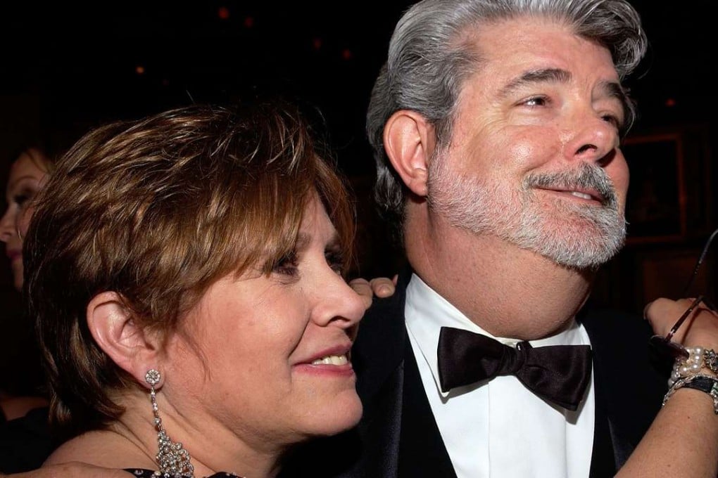 Actress Carrie Fisher and Star Wars creator George Lucas in 2005. File photo:AFP