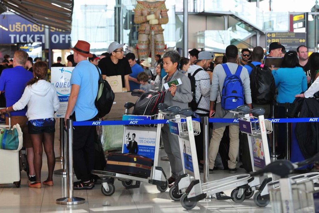 Tourists queue at Suvarnabhumi Airport in Bangkok, Thailand, on Tuesday. Photo: Xinhua