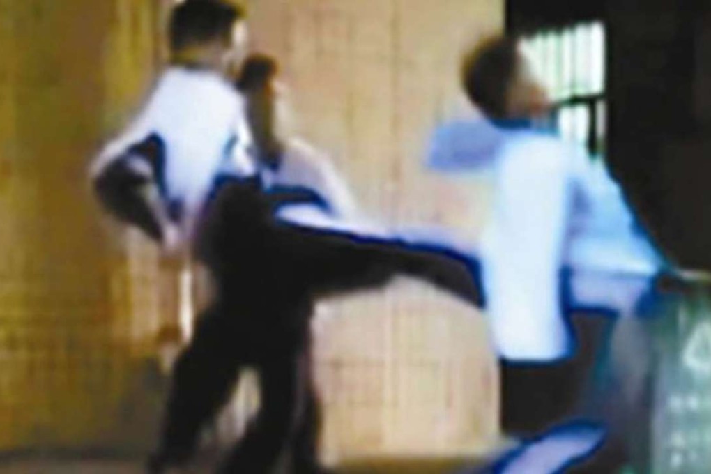 A still from a video allegedly showing Shenzhen schoolboys beating a younger pupil. Photo: Handout