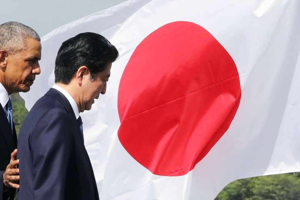 Japanese Prime Minister Shinzo Abe (right) and US President Barack Obama complete their speeches at Pearl Harbour in Hawaii on Tuesday. Photo: Kyodo