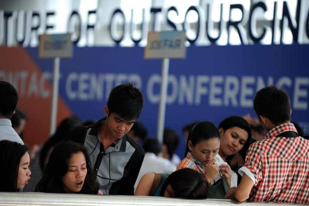 Job seekers at a recruitment fair for call centre agents in Manila. The rapid expansion of the Philippine BPO industry is giving young Filipinos the chance to find middle-class jobs that previously only existed outside the country. Photo: AFP