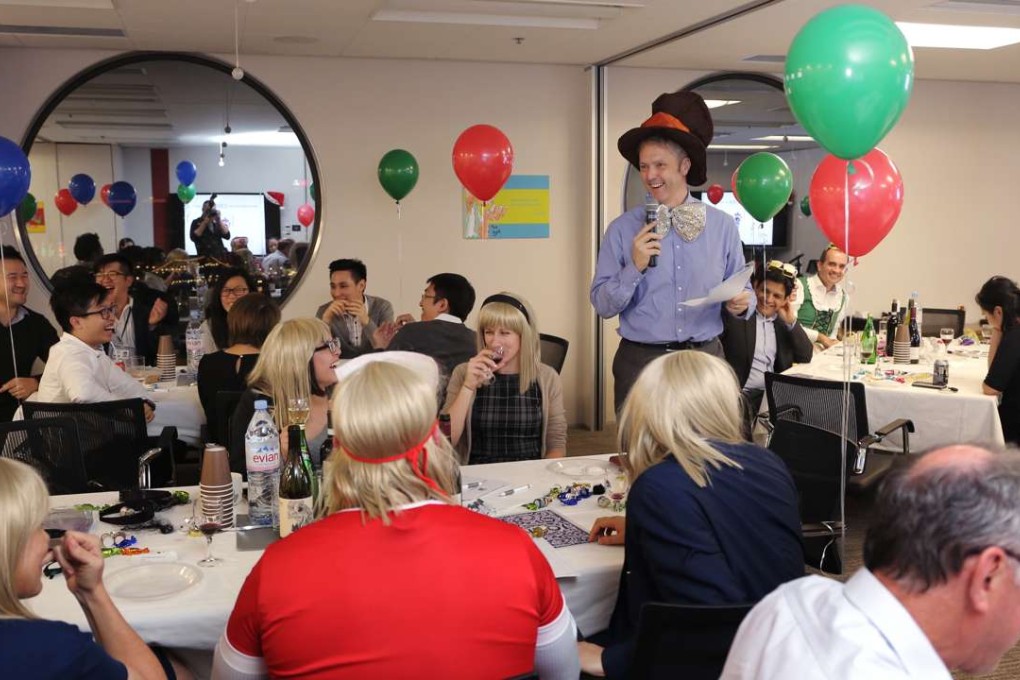 Clifford Chance employees try to come up with the answers in their annual quiz. Photo: Paul Yeung