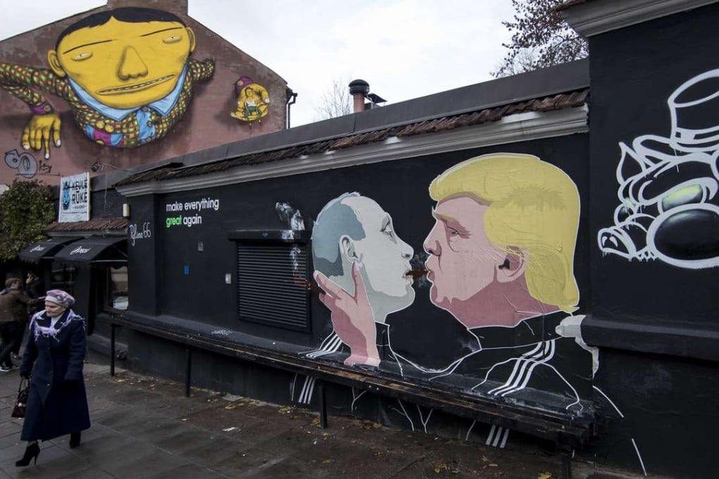 Graffiti artwork depicts Russian President Vladimir Putin and then Republican presidential candidate Donald Trump outside a bar in the old town in Vilnius, Lithuania, on October 30. Photo: AP