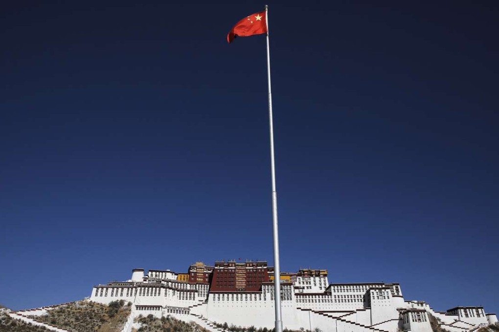 A Chinese flag flies in front of the Potala Palace in Lhasa, once the seat of Tibetan government and the traditional residence of the Dalai Lama. Photo: Reuters