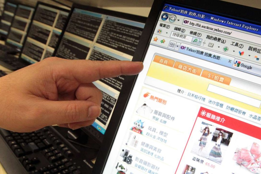 Dr. Michael Kwan Yuk-kwan, Divisional Commander, Copyright Investigation Division, Hong Kong Customs and Excise, briefs the media at a press conference on counterfeit goods sold online. Photo: SCMP