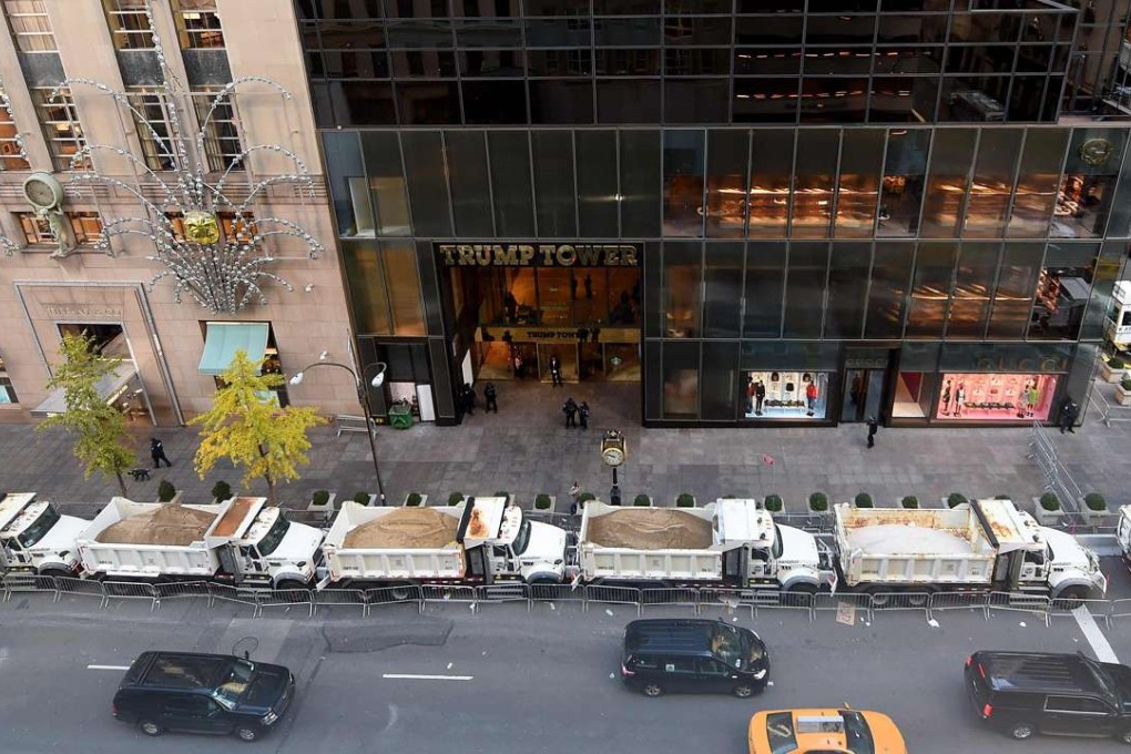 A protective barrier of sand-filled Sanitation Department trucks is parked in front of Trump Tower in Manhattan on November 10, as a counter-terror measure. The same tactic will protect revellers in Tines Square on New Year’s Eve. Photo: AFP