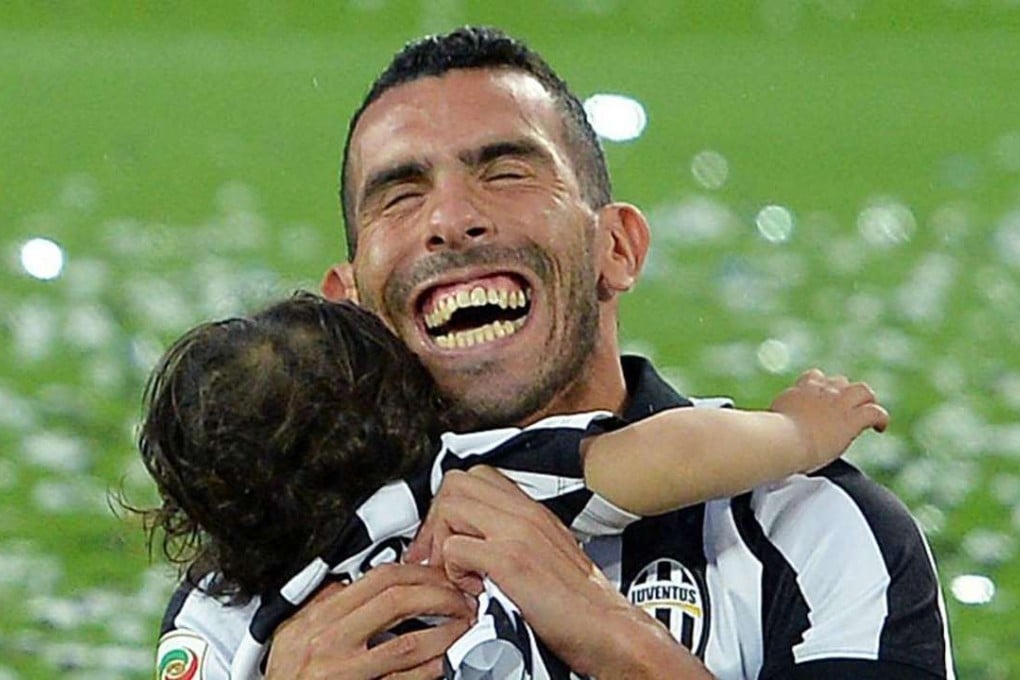 Carlos Tevez with his son Lito Jnr. Photo: AP