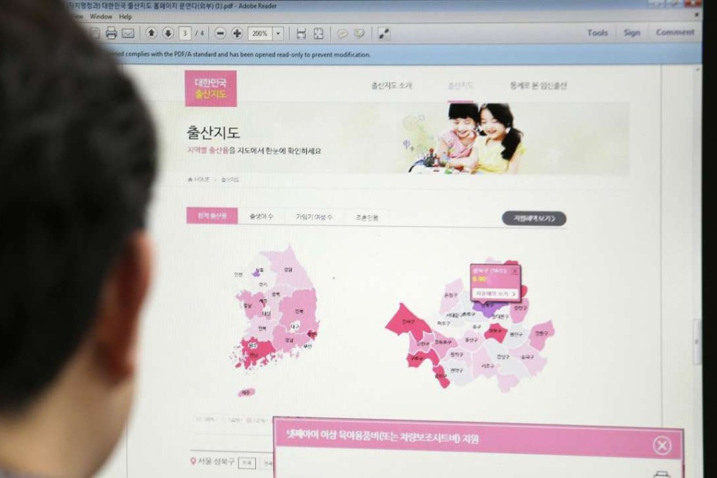 A journalist watches a screen showing a press release from the South Korean Ministry of the Interior about the birth map showing the number of women in childbearing age at his office in Seoul, South Korea, Friday, Dec. 30, 2016. South Korea's government closed its website that drew fury for showing the number of women in childbearing age by each city district and region. The letters at left top read "Birth Map." (AP Photo/Ahn Young-joon)