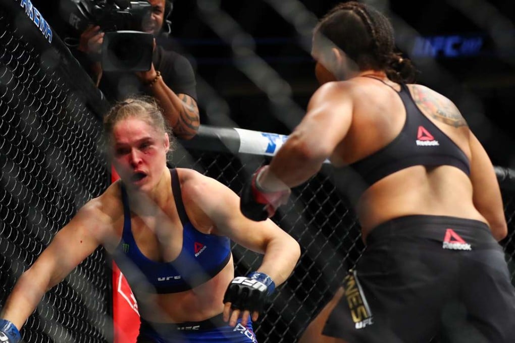 Amanda Nunes (right) lands punches against Ronda Rousey during UFC 207. Photo: USA Today Sports
