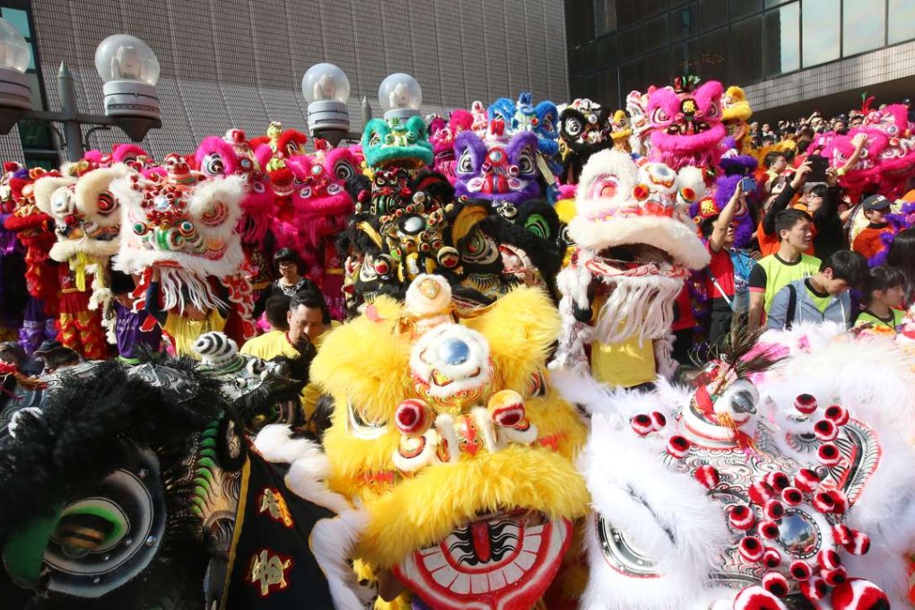 Revellers and parade participants in Tsim Sha Tsui on Sunday. Photo: David Wong