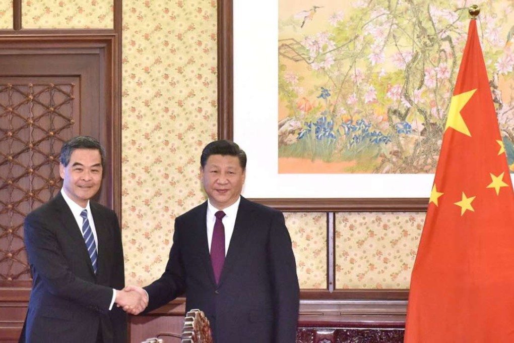 Hong Kong Chief Executive Leung Chun-ying with President Xi Jinping in Beijing on December 23. Photo: Information Services Department