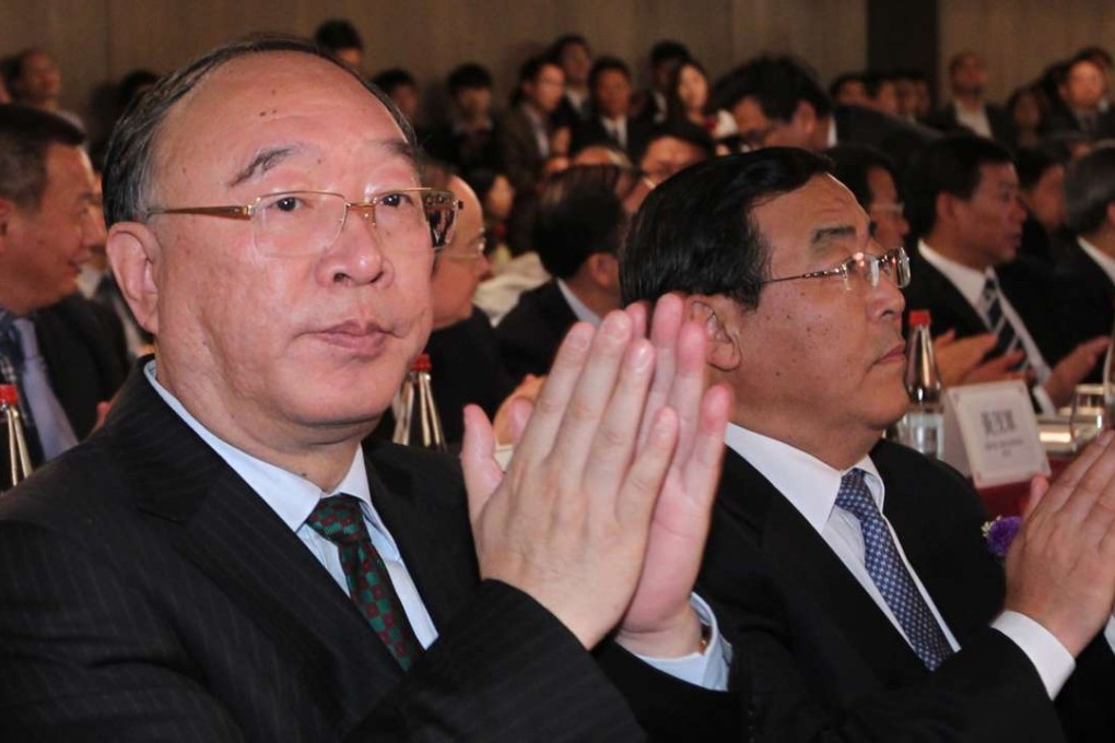 Huang Qifan (left) pictured at an event in Hong Kong while serving as mayor of Chongqing in 2013. Photo: SCMP Pictures