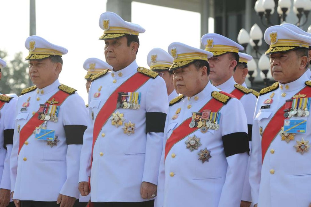 Thai Prime Minister Prayuth Chan-ocha (3rd L, front) and other officials attend a ceremony marking Thai Constitution Day at the Government House in Bangkok in December. Photo: Xinhua