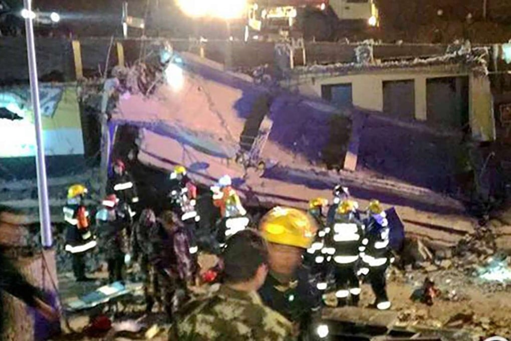 Authorities survey the damage in Hengshan, Yulin, Shaanxi province, where a public toilet exploded and collapsed on New Year’s Eve. Photo: Handout