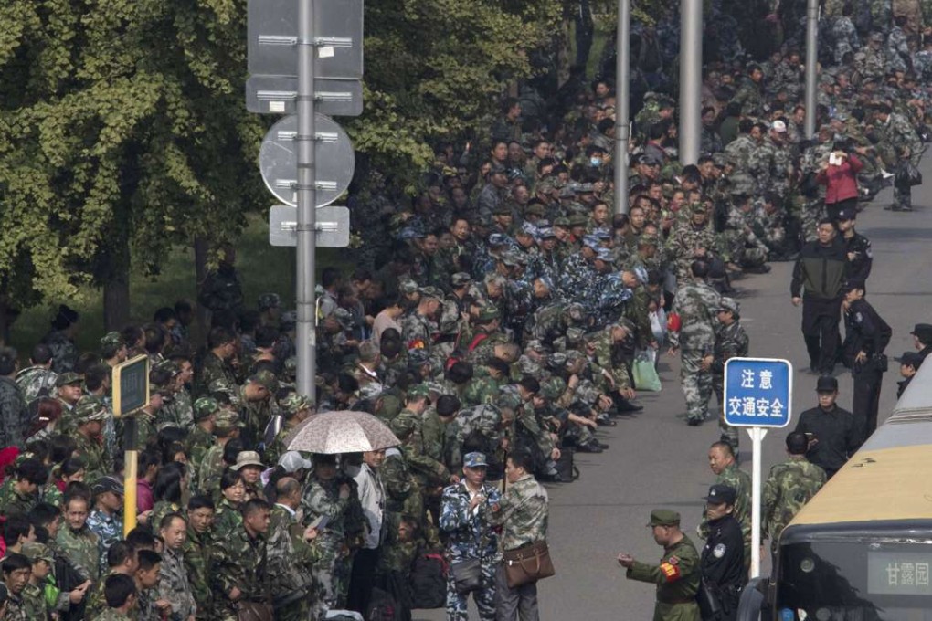 Protesting veterans outside the military headquarters in Beijing on October 11. Photo: AP