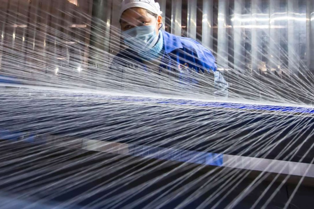 China’s official manufacturing PMI fell to 51.4 in December from 51.7 in November, but remained well above the threshold of 50 that separates expansion from contraction. Photo: AFP