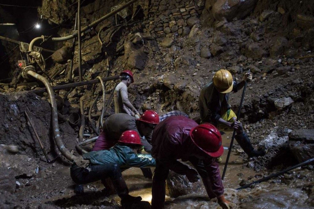 Miners working inside a ruby mine. Photo: AFP