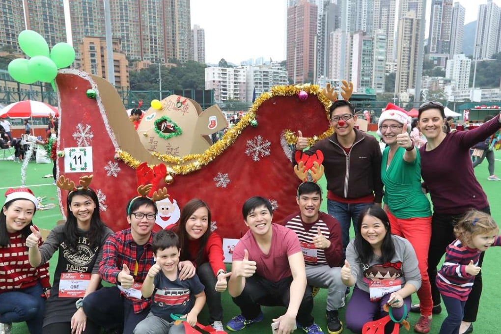 Company employees and children at an Operation Santa Claus event in Happy Valley in December. Photo: Edward Wong