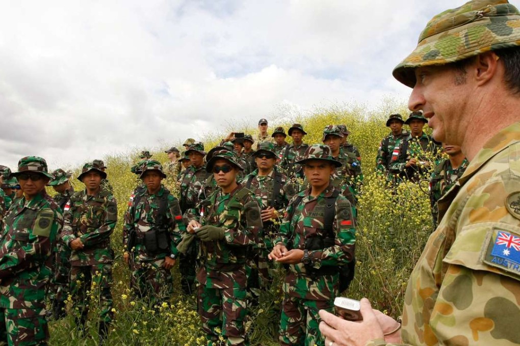 An Australian soldier briefs Indonesian personnel during joint drills. Photo: Reuters
