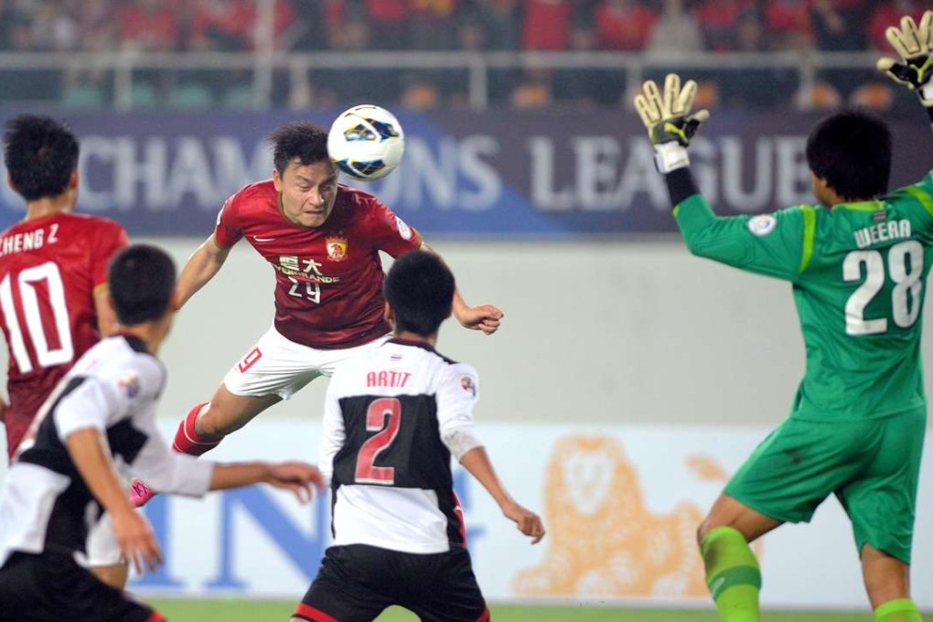 Muangthong United defend against China’s Guangzhou Evergrande in the 2013 tournament. Photo: Xinhua
