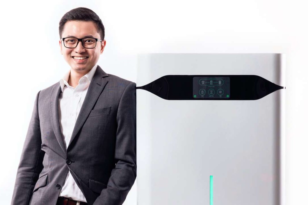 Brandon Ng, co-founder of Ampd Energy, next to an Ampd Silo unit. Photo: Handout