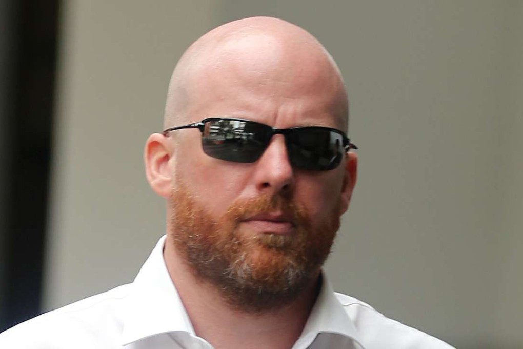 Swiss banker Jens Fred Sturzenegger leaving a district court in Singapore. Photo: AFP