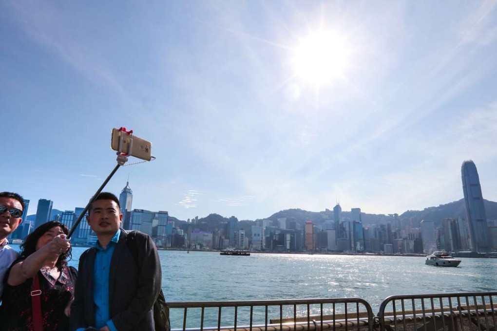 Fewer hours and days of high health risk air were ­recorded at both ambient and roadside stations last year, affording more blue skies over the harbour. Photos: Felix Wong