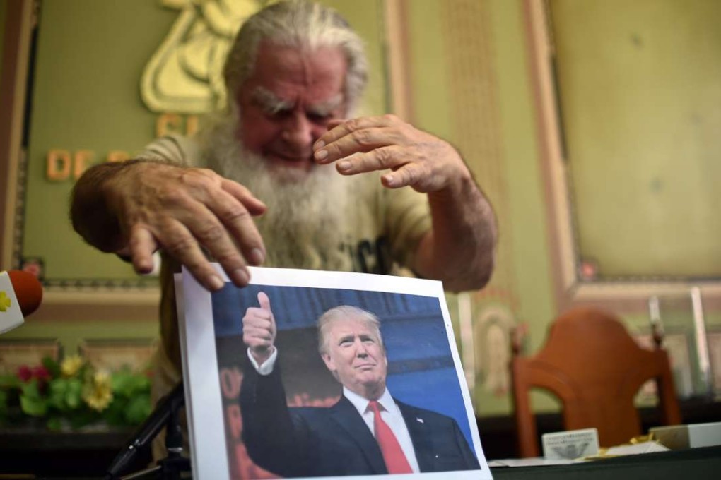 In Mexico City, a self-proclaimed sorcerer puts “a spell” on US President-elect Donald Trump. Photo: AFP