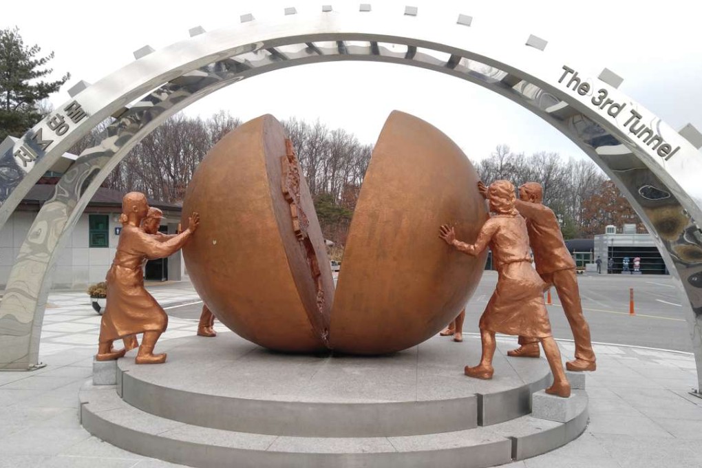 A pro-unification sculpture on the South Korea side of the demilitarisation zone that separates it from the North. The split earth indicates the sadness of a country torn into two parts, with people from each side attempting to push the two parts together. Photo: Minnie Chan