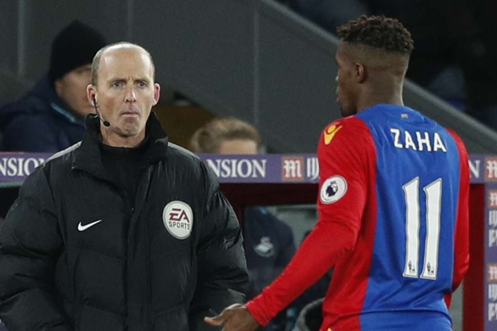 Premier League official Mike Dean often takes up the role of pantomime bad guy. Photo: Reuters