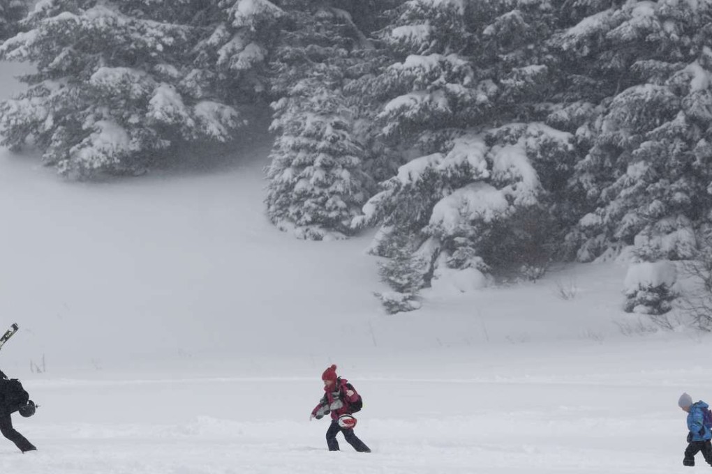 Skiers walk through the snow after skiing on Mount Bjelasnica near Sarajevo, Bosnia on Friday. The country and region was bracing for a spell of extremely frigid weather with temperatures expected to remain between - 11 and - 26 degrees centigrade (from 5 to - 14.8 degrees Fahrenheit). Photo: AP