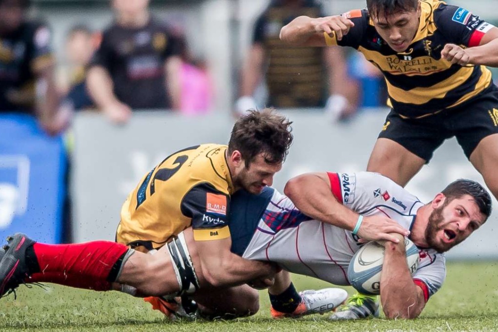 HK Scottish captain Kane Boucaut is brought to ground as his side come from 14 points down to defeat Tigers in the Hong Kong Premiership on Saturday. Photos: HKRU