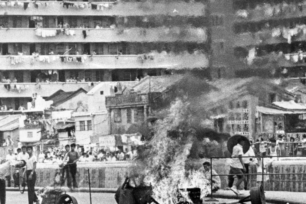 Demonstrators burn the bamboo baskets during the Hong Kong riots in 1967.