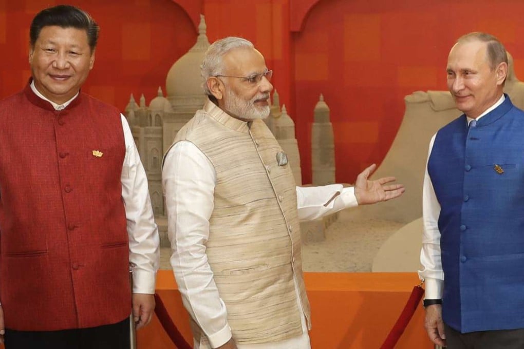 President Xi Jinping and Russian President Vladimir Putin prepare to attend a dinner hosted by Indian Prime Minister Narendra Modi (centre) for leaders of BRICS nations in the Indian state of Goa last October. Beijing’s deepening alliance with Russia and Pakistan is alarming Delhi. Photo: AP