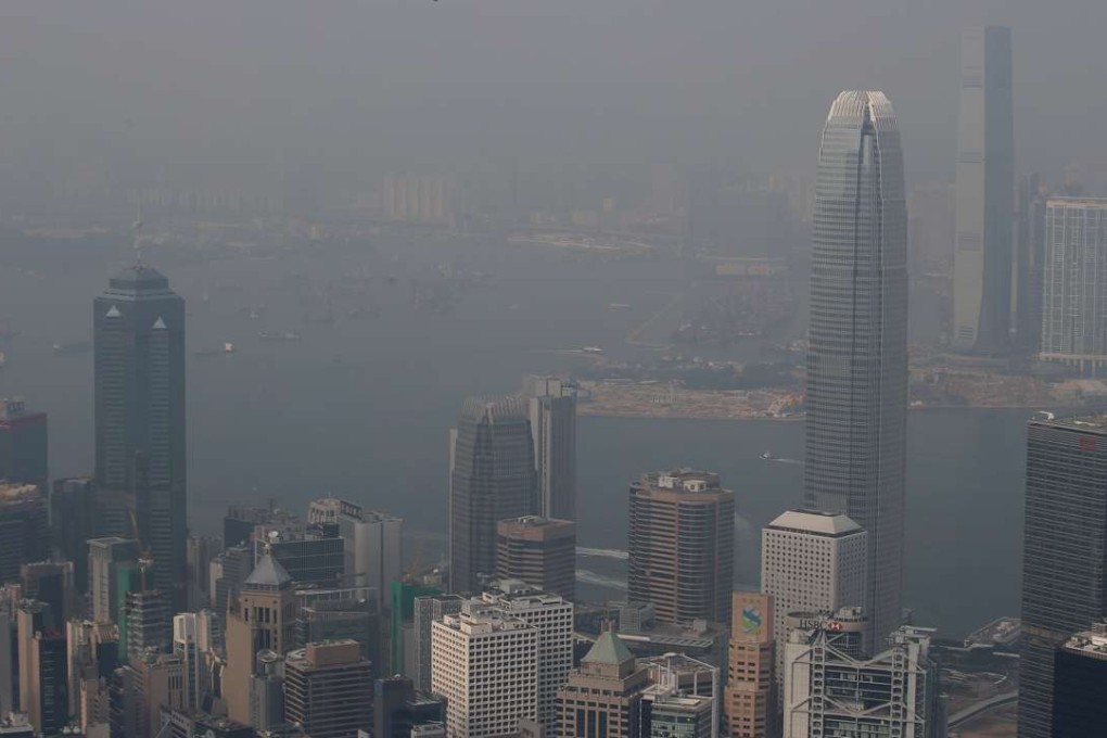 A view of Victoria Harbour under the haze on Sunday. Photo: David Wong
