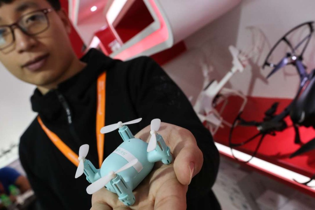 Sales manager Chen Runyan displays a drone at the toy fair in Hong Kong. Photo: Nora Tam