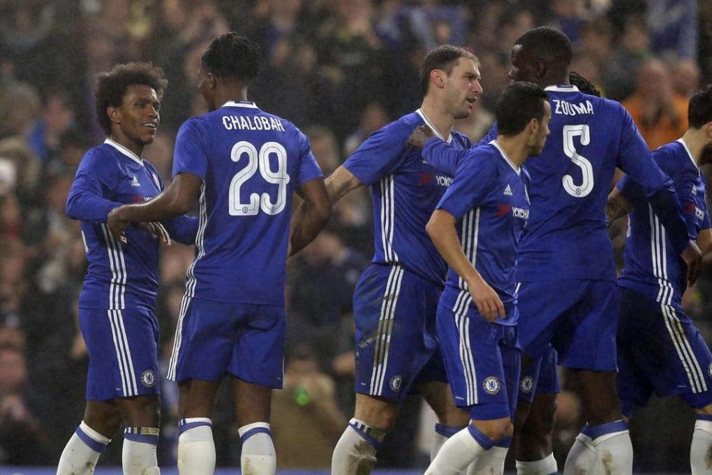 Chelsea’s Willian celebrates after scoring his side’s third goal in the win against Peterborough United. Photo: AP