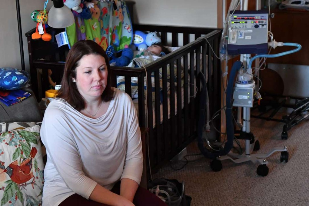 Lindsay Weekes sits near her 2-year-old son Quinlan Weekes who was born severely disabled due to an extremely rare genetic mutation diagnosed by WuXi NextCODE, through analysis of his genome. Photo: The Washington Post