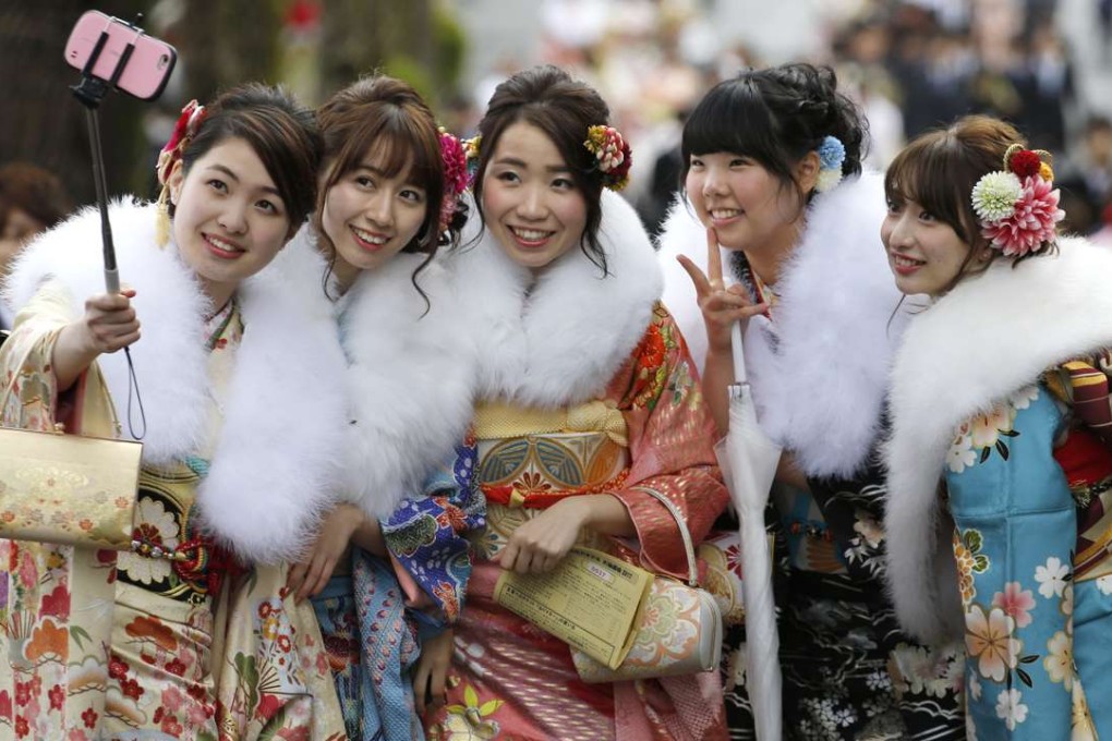 A group of Japanese youths dressed in kimonos celebrate turning 20 years old. Photo: AP