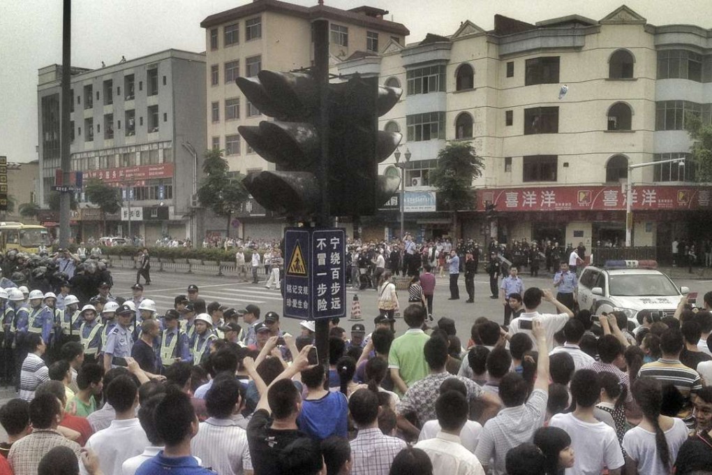 Striking workers at a Yue Yuen factory in Dongguan in April 2014. The company employs more than 400,000 workers in China, Vietnam and Indonesia. Photo: Reuters