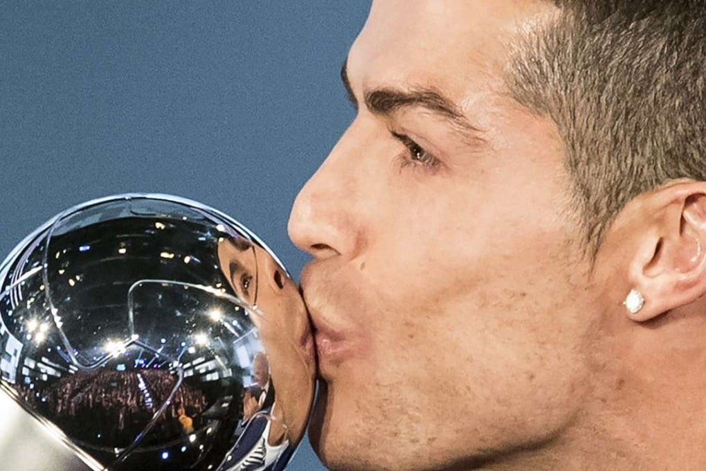 Real Madrid’s Cristiano Ronaldo kisses his trophy after winning the Fifa best player award during the Fifa Awards 2016 gala in Zurich. Photo: EPA