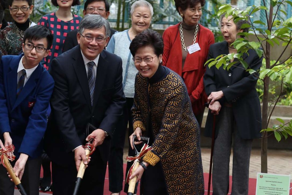 Au Kwong-wing, principal at the Chinese Foundation Secondary School and Chief Secretary Carrie Lam Cheng Yuet-Ngor. Photo: Nora Tam