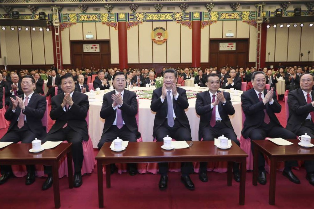 China’s top leaders attend a New Year gathering in Beijing organised by the National Committee of the Chinese People’s Political Consultative Conference: Xi Jinping (centre), Li Keqiang (third from right), Zhang Dejiang (third from left), Yu Zhengsheng (second from right), Liu Yunshan (second from left), Wang Qishan (far right) and Zhang Gaoli (far left). Photo: Xinhua