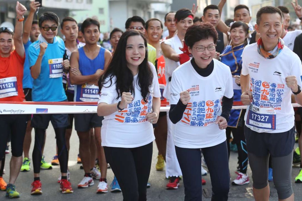 Chief Secretary Carrie Lam (front centre) attends a street run in Kwun Tong. Lam is expected to resign this week to run in the chief executive race in March. Photo: Nora Tam