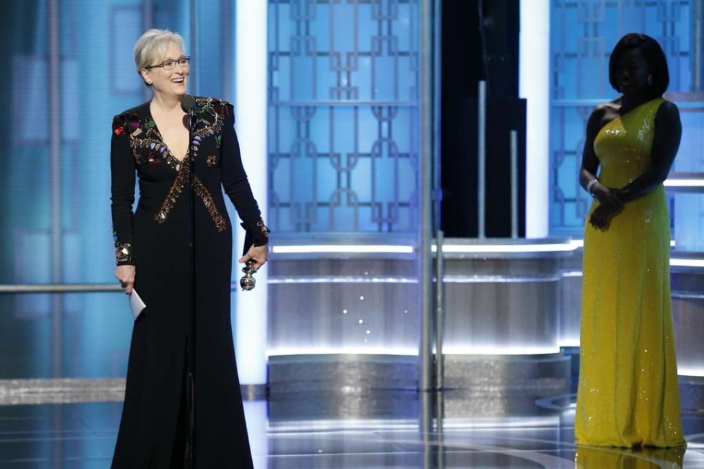 This image released by NBC shows Meryl Streep accepting the Cecil B. DeMille Award as presenter Viola Davis, right, looks on, at the 74th Annual Golden Globe Awards at the Beverly Hilton Hotel on Sunday. Ohoto: AP
