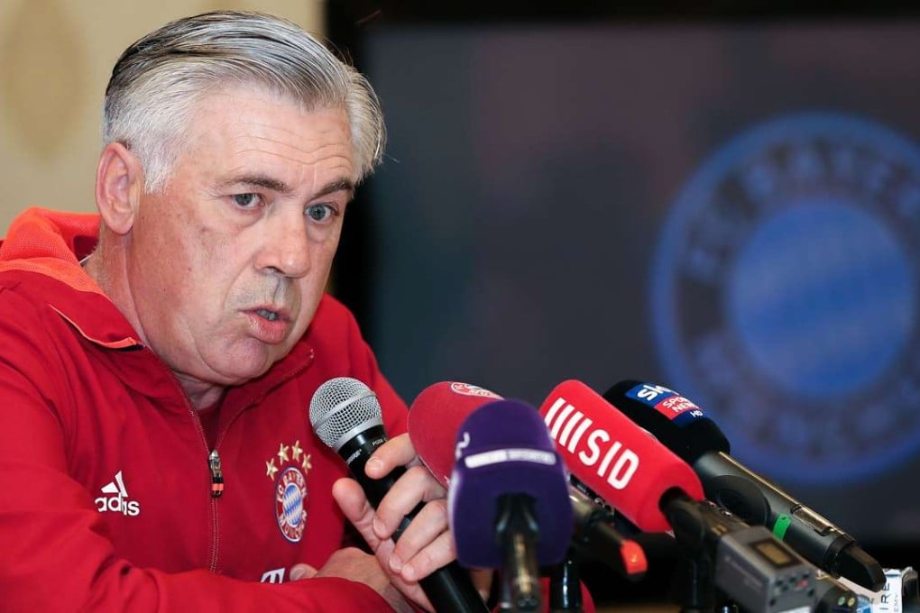 Carlo Ancelotti, head coach of German football club Bayern Munich, gives a press conference in the Qatari capital Doha on January 10, 2017. Bayern Munich is training at the Aspire Academy in Doha, Qatar. / AFP PHOTO / KARIM JAAFAR